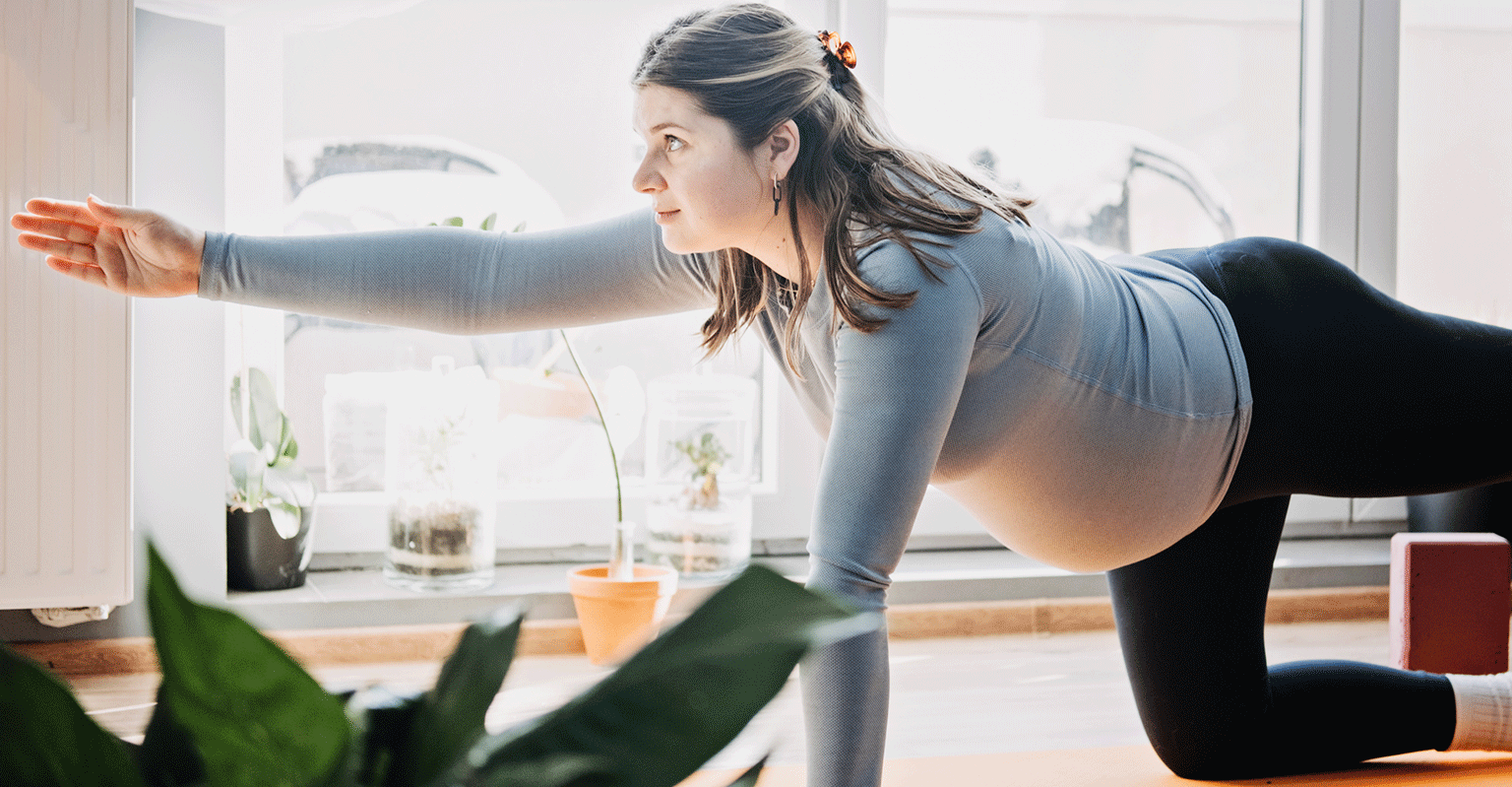 woman doing prenatal yoga