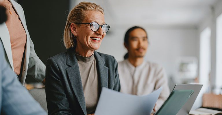smiling woman at meeting at work