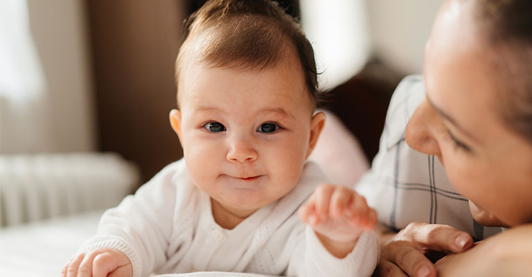 baby reaching out arm