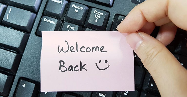 "welcome back" written on a sticky note