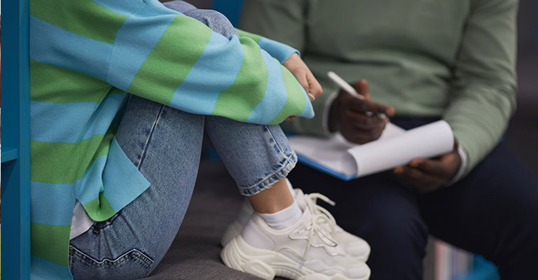 teenager talking with adult