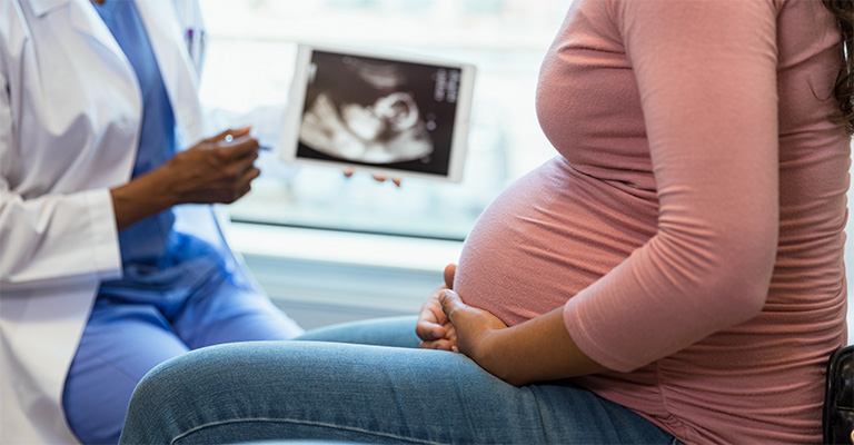 pregnant person at provider visit