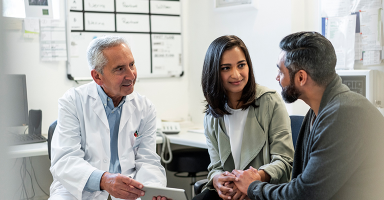 couple in fertility consultation with provider