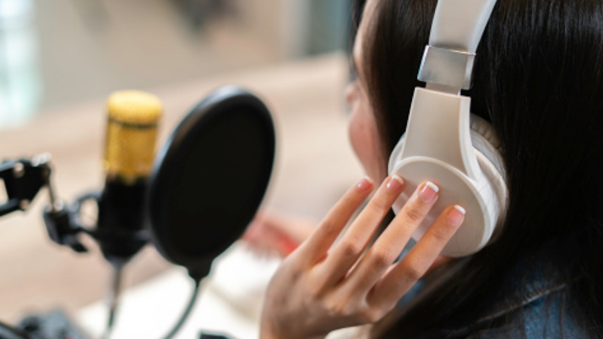 woman on headphones listening to podcast