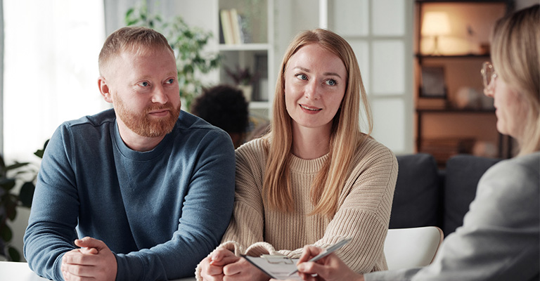 young couple meeting about the adoption process