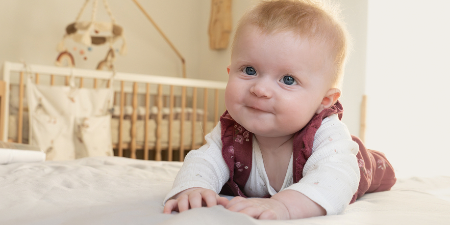 baby crawling in nursery room