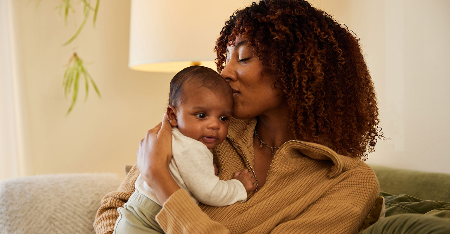 woman holding her baby